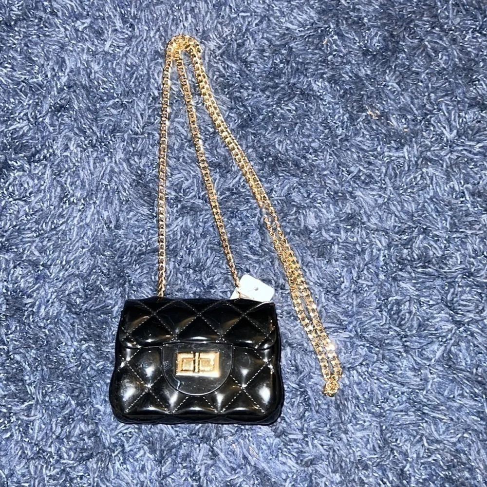 Patent leather jelly purse with gold tone chain. Black. NWT